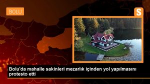 Mezarlığın içinden yol geçeceğini duyan mahalleli deliye döndü! İş makinesinin önüne yatarak engellemek istediler